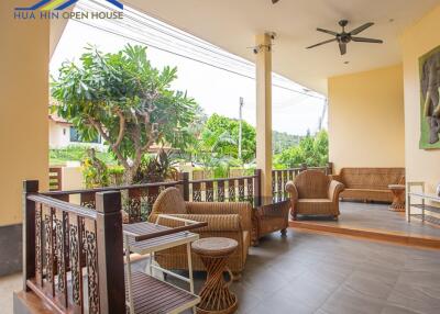 Outdoor covered patio with seating area