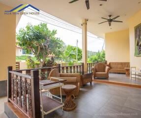 Outdoor covered patio with seating area