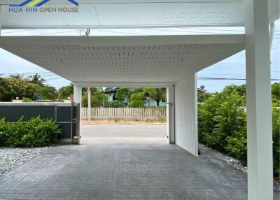 Covered garage with driveway