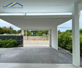 Covered garage with driveway