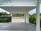 Covered garage with driveway