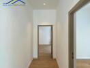 Clean and bright hallway with wooden flooring