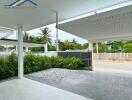 Modern covered driveway with garden