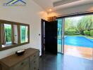 Bedroom with a view of the swimming pool