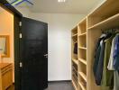 Walk-in closet with organized shelving and hanging space