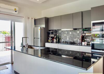Modern kitchen with island counter and appliances