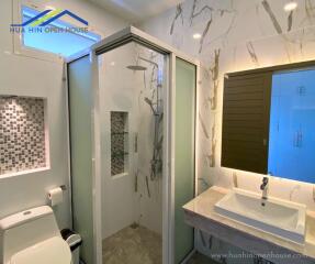 Modern bathroom with shower and vanity