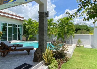 beautiful backyard with pool and greenery