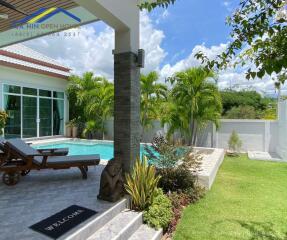 beautiful backyard with pool and greenery