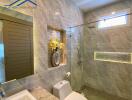 Modern bathroom with a shower, toilet, and decorative flowers.