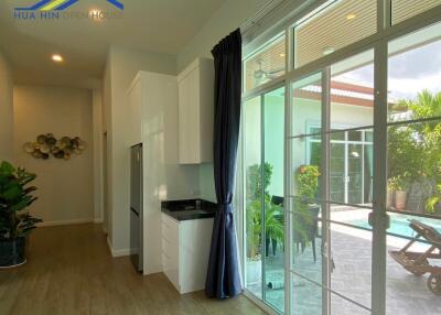 Modern kitchen area with a view of the patio.