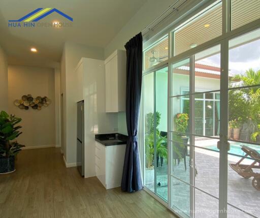 Modern kitchen area with a view of the patio.