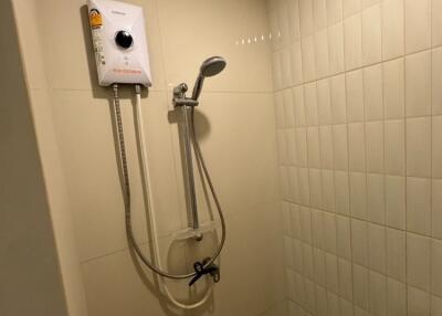 Shower area with electric water heater