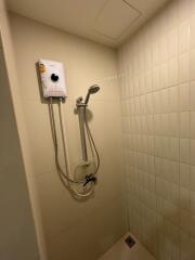 Shower area with electric water heater