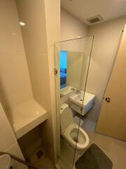 Modern bathroom with glass shower and white fixtures