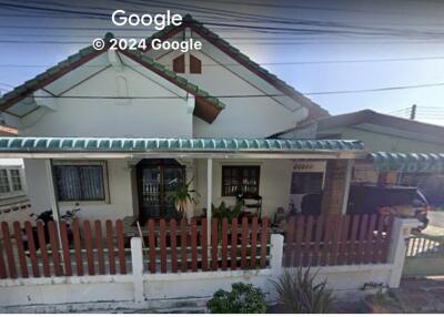 Front view of a residential house with a fence