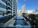 High-rise building with outdoor swimming pool and city view