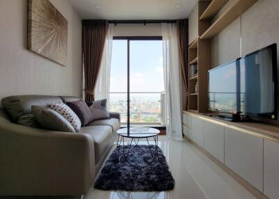 Modern living room with large window and city view