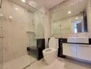 Modern bathroom with glass shower and large mirror