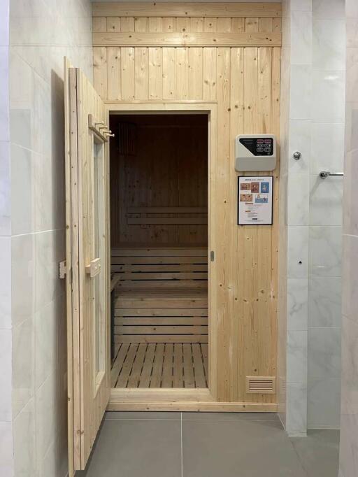 Indoor wooden sauna with open door