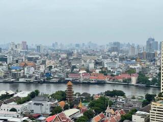 Aerial view of a cityscape with river and buildings