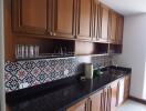 Modern kitchen with wooden cabinets and patterned backsplash