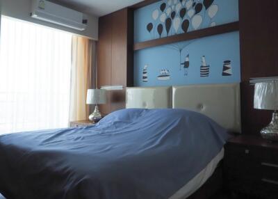 Bedroom with air conditioner and artistic wall decor