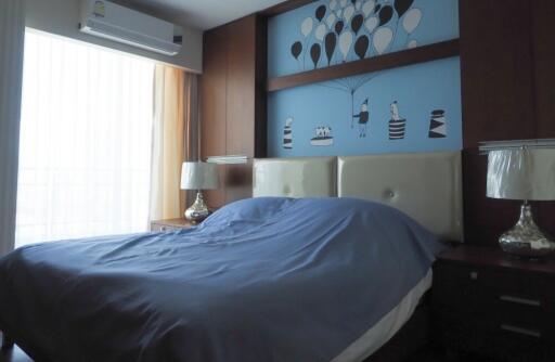 Bedroom with air conditioner and artistic wall decor