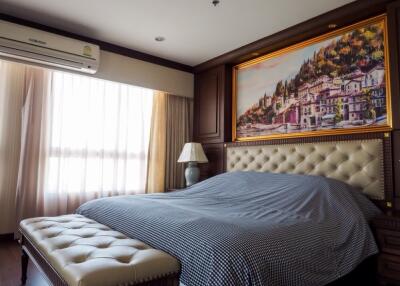 Cozy bedroom with artwork and natural light