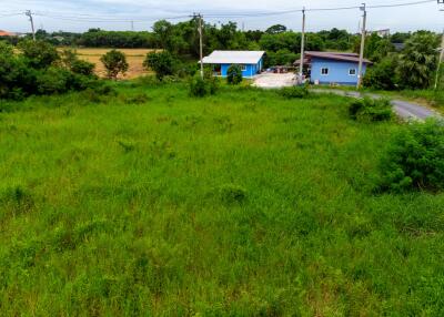 aerial view of vacant land with adjacent buildings