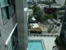 View from building overlooking pool and cityscape