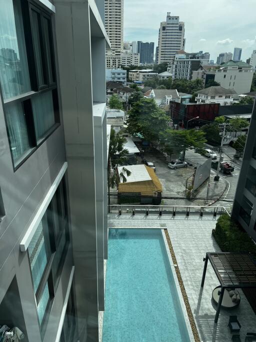 View from building overlooking pool and cityscape