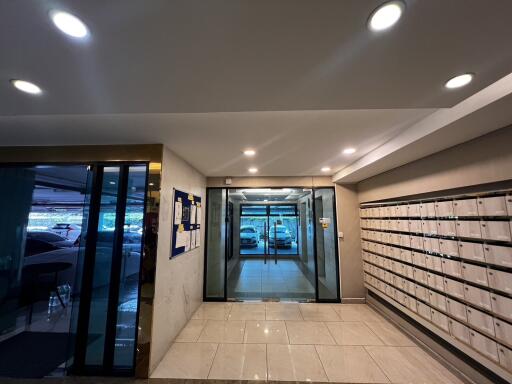 Modern apartment building entrance with mailboxes