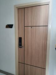 Modern wooden apartment entrance door with electronic lock