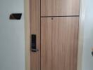 Modern wooden apartment entrance door with electronic lock