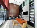 Modern dining area with high ceiling and elegant decor