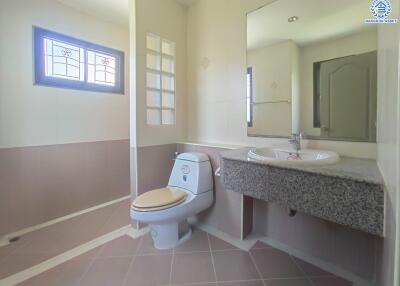 Bathroom with large mirror and modern fixtures