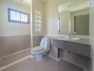 Bathroom with large mirror and modern fixtures