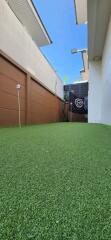 Outdoor area with artificial turf suitable for recreation