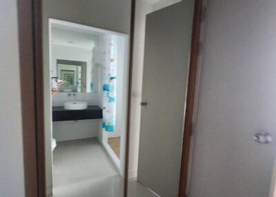 Bathroom with mirrored wardrobe and sink