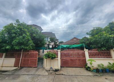 Front view of a residential house with a garden