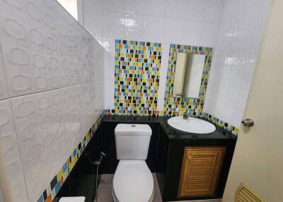 Bathroom with colorful mosaic tiles and modern amenities