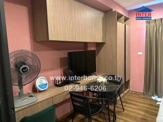 Living room with wooden furniture, a fan, and a television