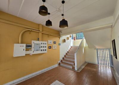Staircase with electrical panel and decor