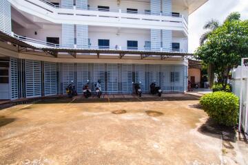 Apartment building exterior with parking area