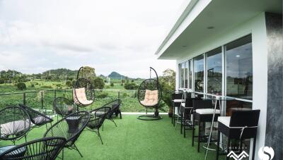 Outdoor patio with seating and scenic view