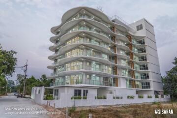 Exterior view of Mirage Condominium, showcasing its unique, modern architecture