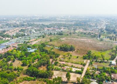 Aerial view of suburban land and housing