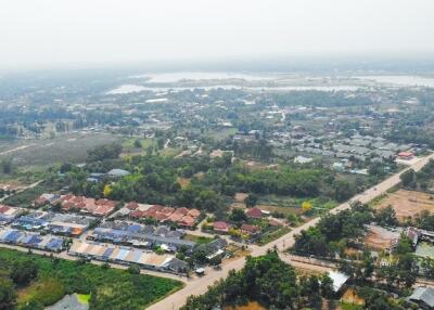 Aerial view of a residential area and surroundings.