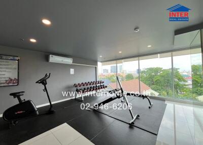 Fitness room with exercise equipment and a view